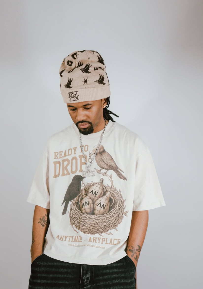 Model wearing cream Ready to Drop bird graphic tee